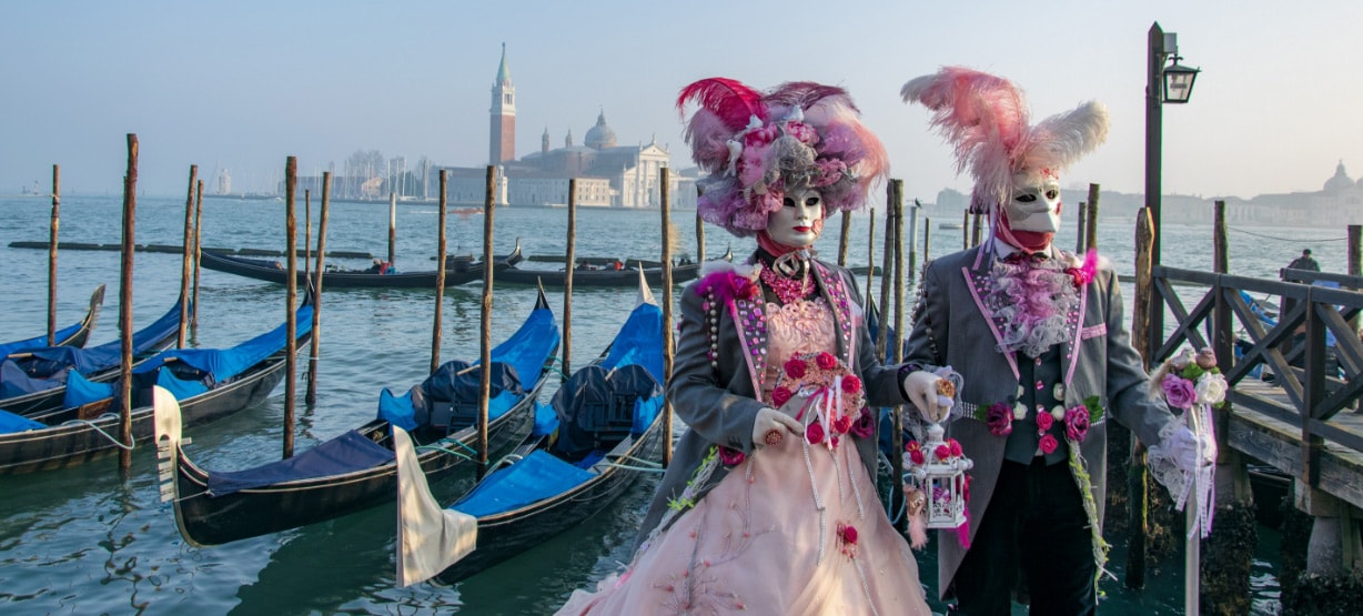 masked couple for the venice carnival in traditional costumes