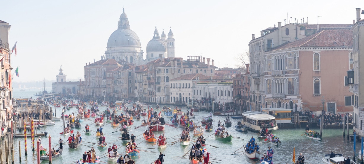 Parade of gondolas during the Venice Carnival.